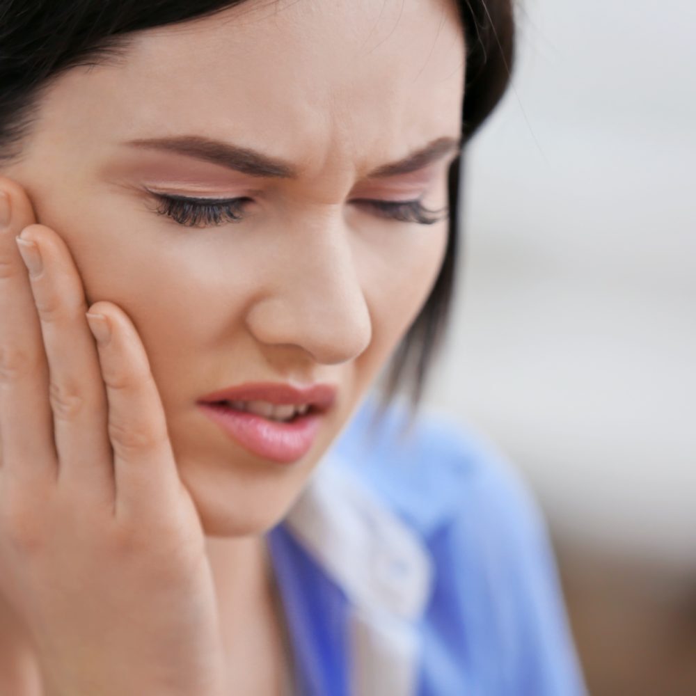 Woman suffering from toothache